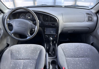 Подержанный автомобиль Kia Spectra Sedan 2008 года (9 фото)