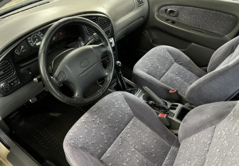 Подержанный автомобиль Kia Spectra Sedan 2007 года (9 фото)