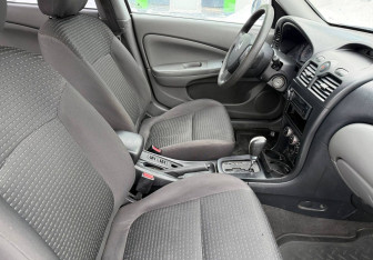 Подержанный автомобиль Nissan Almera Classic 2009 года (10 фото)