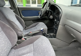 Подержанный автомобиль Kia Spectra Sedan 2006 года (10 фото)