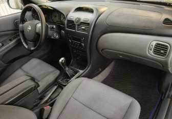 Подержанный автомобиль Nissan Almera Classic 2007 года (11 фото)