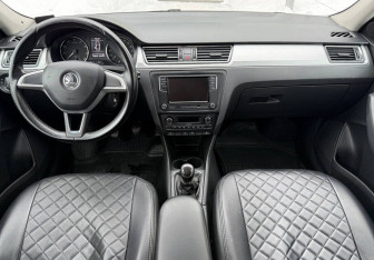 Подержанный автомобиль Skoda Rapid Liftback 2014 года (9 фото)